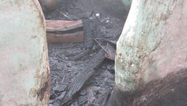 CHARRED REMNANTS: A portion of a house that was burnt down in a clash at W Pudupatti Village on Sunday 