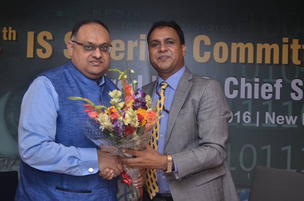 Shri Devesh Chandra Srivastava, IPS, Executive Director-Chief Security, ONGC being presented a bouquet of flowers to Shri Sandeep Mittal, IPS, 